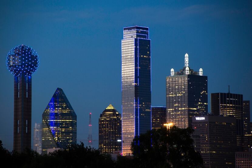 The downtown Dallas skyline lights up in blue in recognition of National Police Week on...