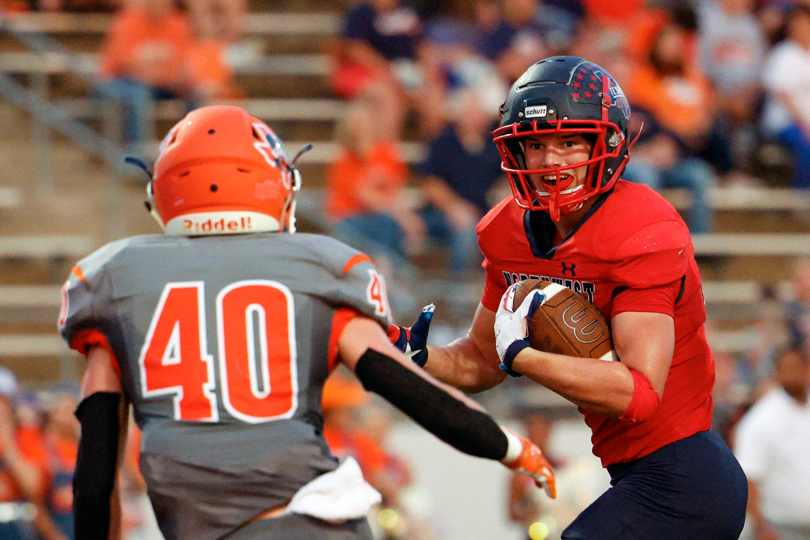 Justin Northwest running back Kyle Cummings (22) eyes McKinney North safety Jackson Lakotas...