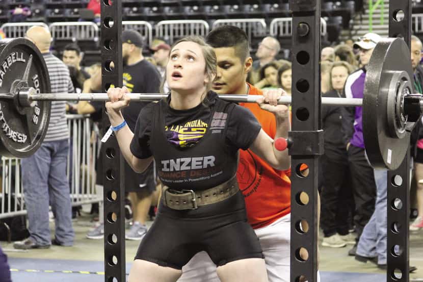 Sanger's Erin Escobedo prepares for a lift during compeitition on March 20, 2015 at the...