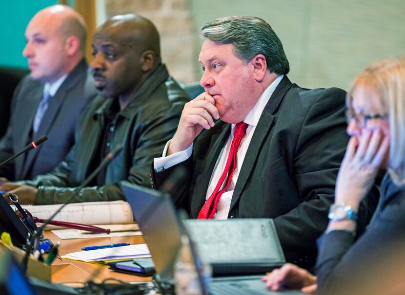 Above right:  Wylie Mayor Eric Hogue (center), and members of the Wylie City Council listen...