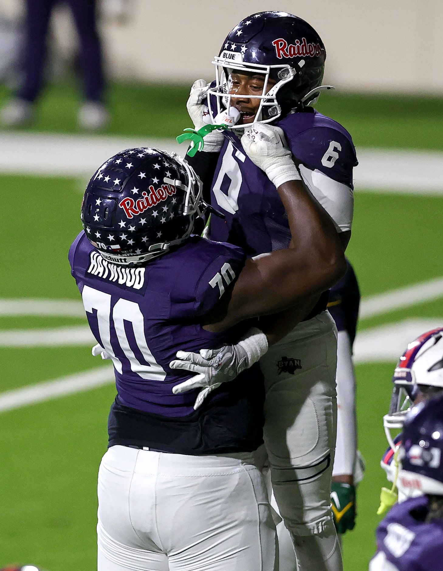 Denton Ryan running back Tre'Vaughn Reynolds (6) celebrates with offensive lineman Ty...