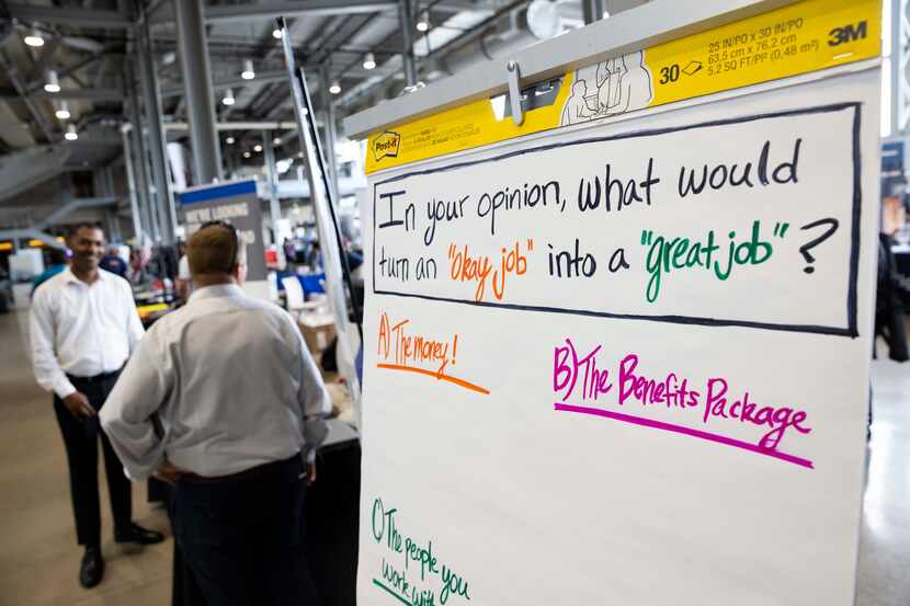 A sign at job fair at AT&T Stadium in early May prompts candidates to consider what makes a...