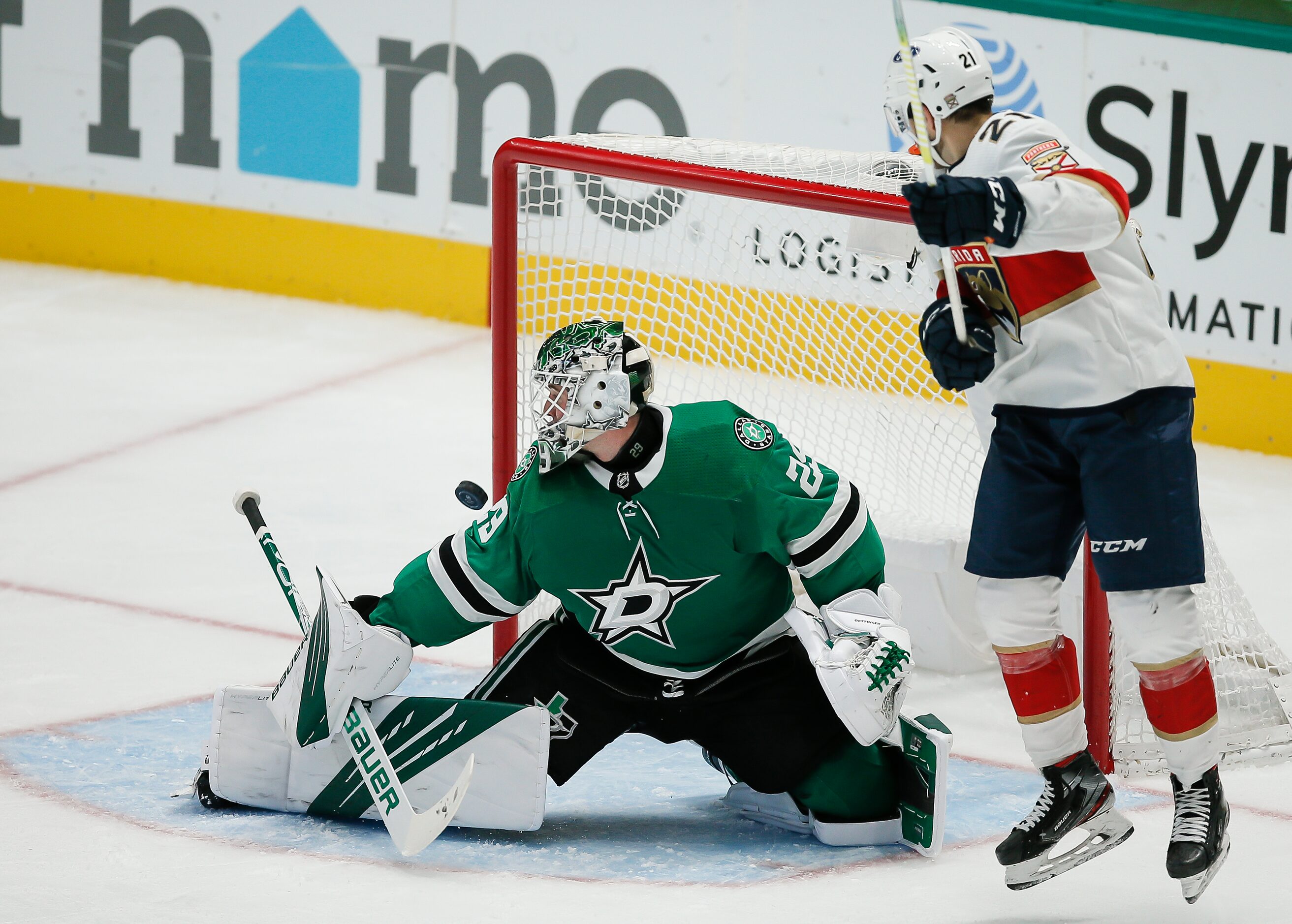 Florida Panthers forward Alex Wennberg (21) looks on as a shot from teammate forward Brett...