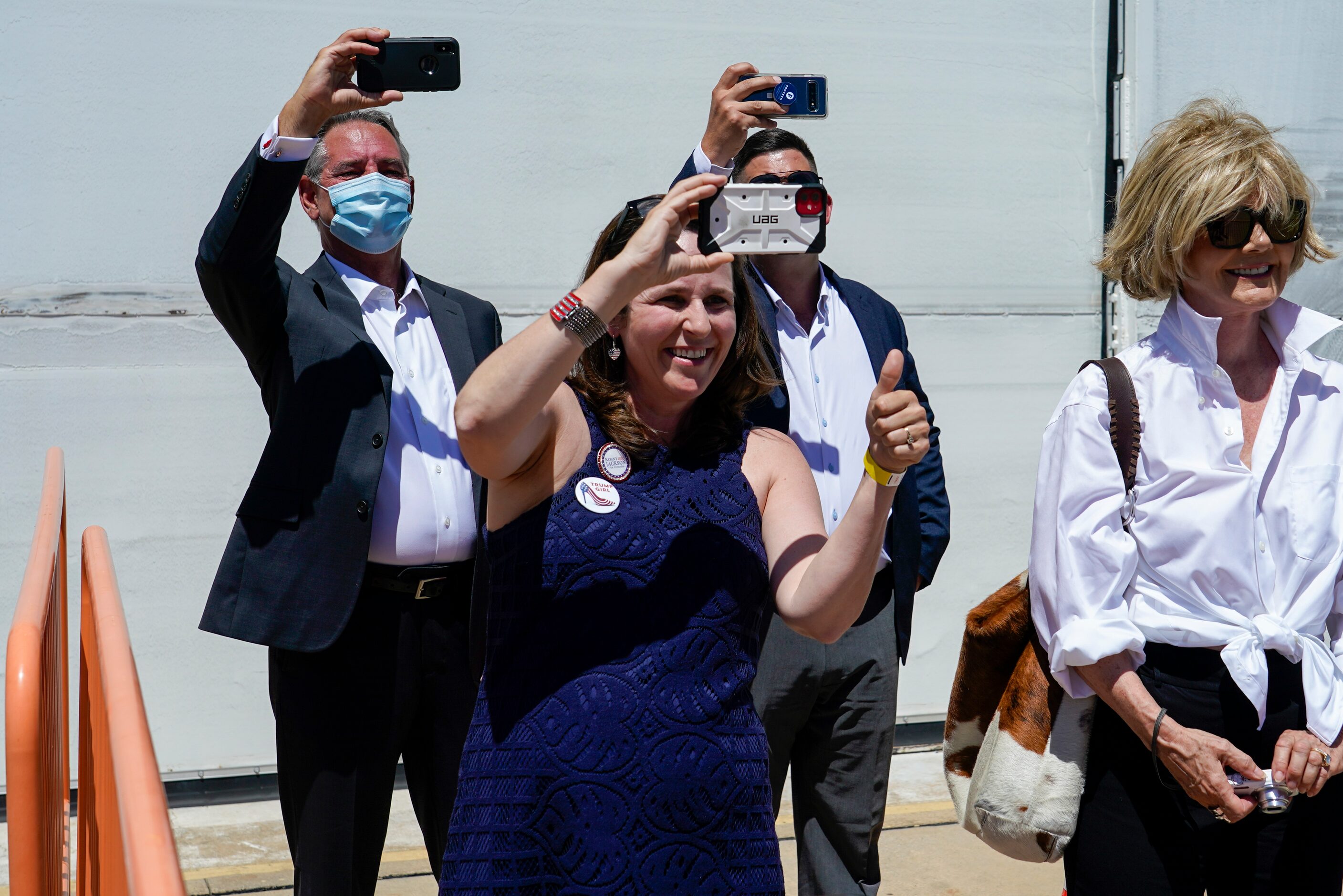 Supporters cheer President Donald Trump as he arrives at Dallas Love Field on Thursday, June...