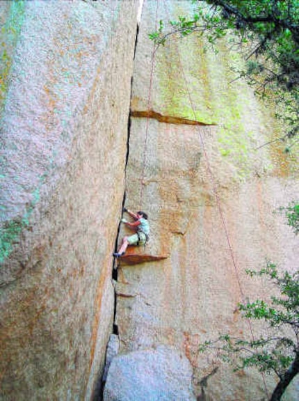 Cheryl Chunco makes her way up the wall called Fear of Flying at Enchanted Rock State...