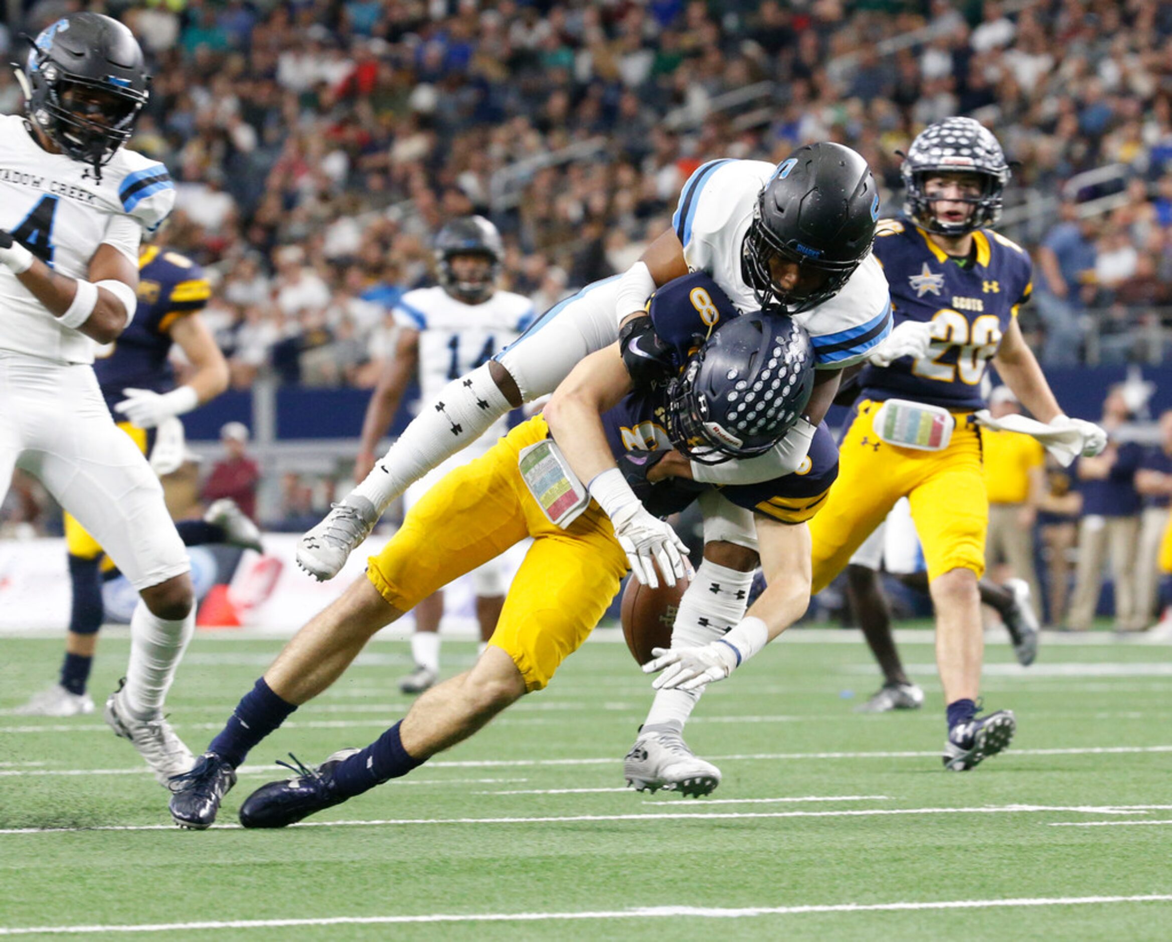 Shadow Creek's Jevin Murray (5) breaks up a pass intended for Highland Park's  Bennett Brown...