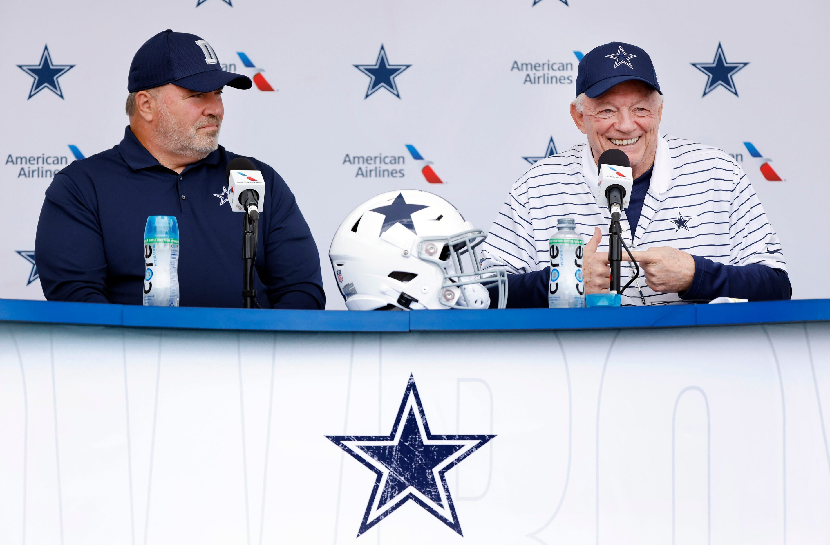 Dallas Cowboys owner Jerry Jones (right) jokes with the media during his kickoff press...