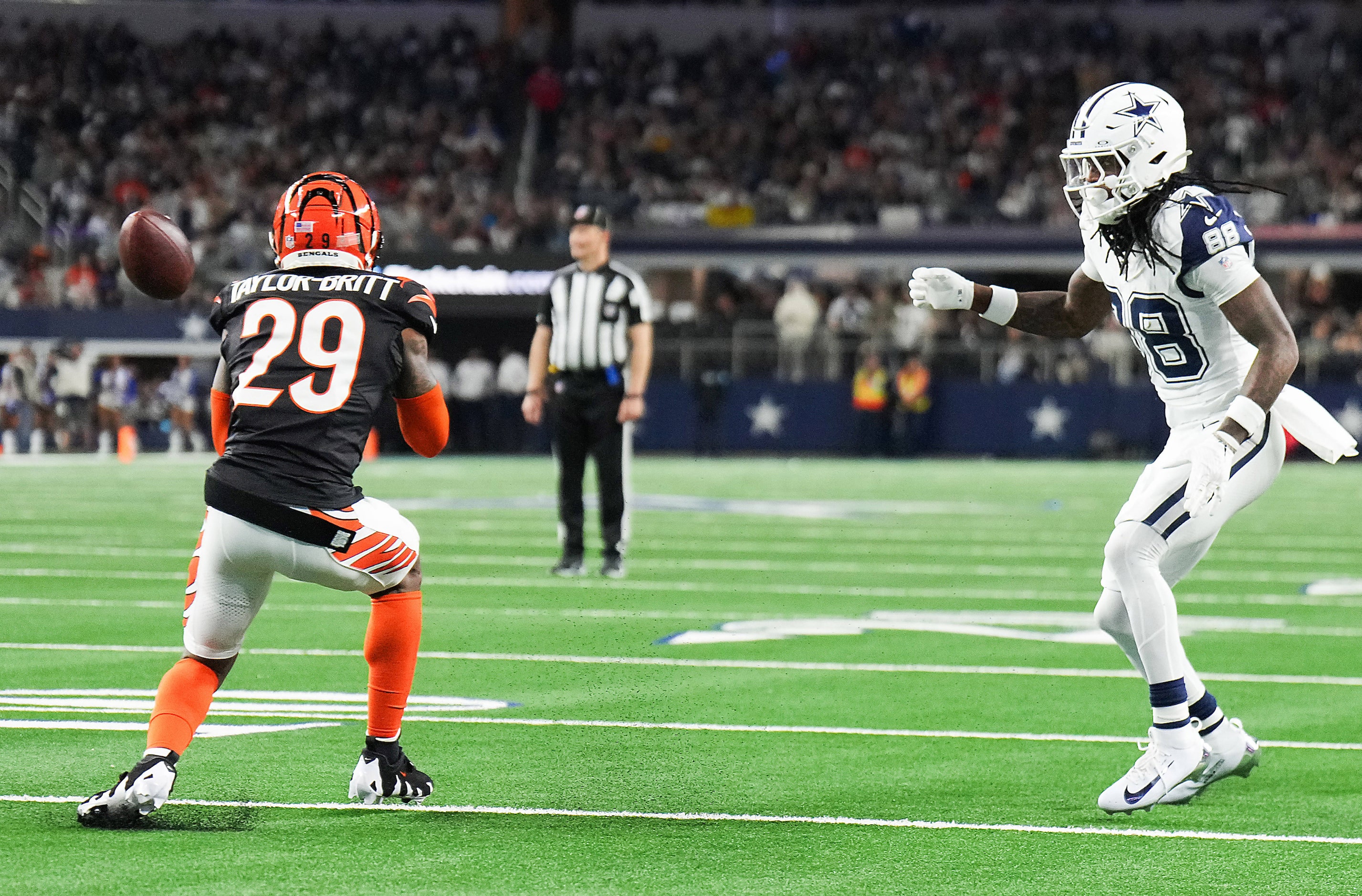 Cincinnati Bengals cornerback Cam Taylor-Britt (29) tips a pass intended for Dallas Cowboys...