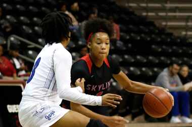 Skyline's Jazion Jackson (1) displays some fancy footwork as she maneuvers around the...