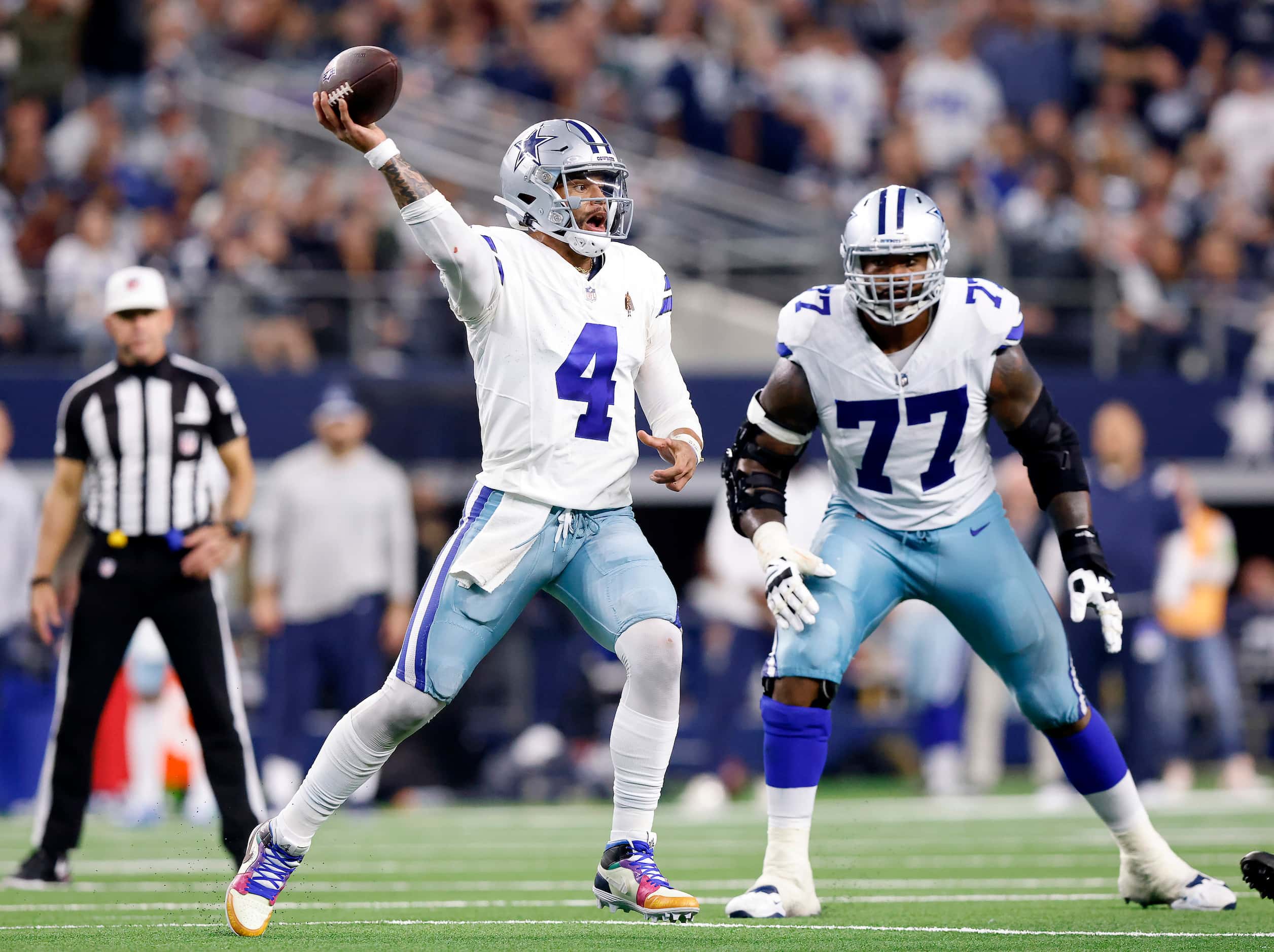 Dallas Cowboys quarterback Dak Prescott (4) throws an out pass during the fourth quarter...