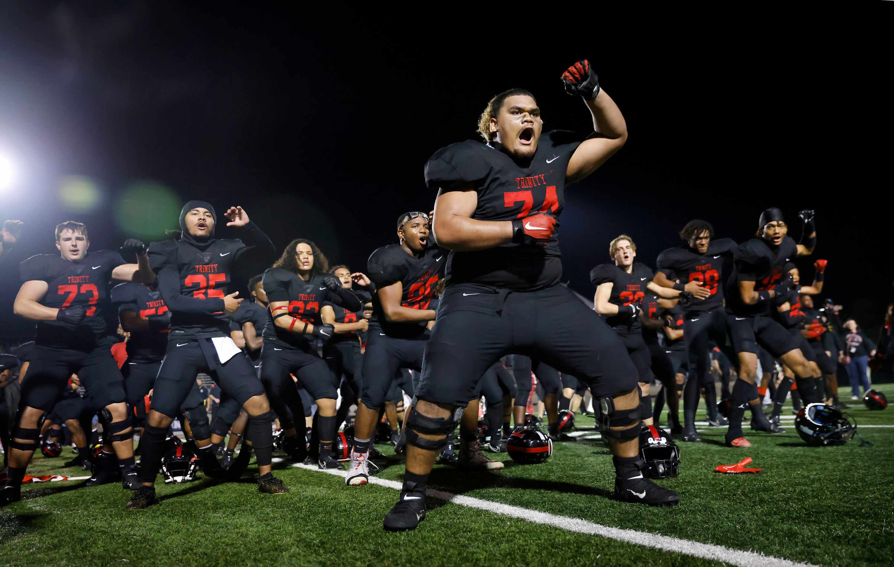 Euless Trinity’s Phillip Tuipilotu (74) leads a post-game Sipi Tau after beating Hurst L.D....