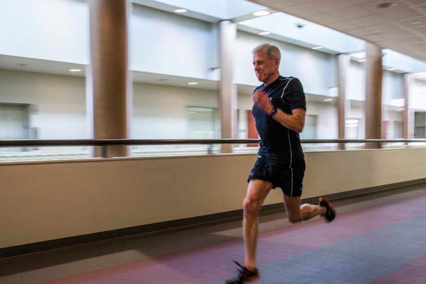 Bill Vick runs on the track at Carpenter Park Recreation Center in Plano. He started...