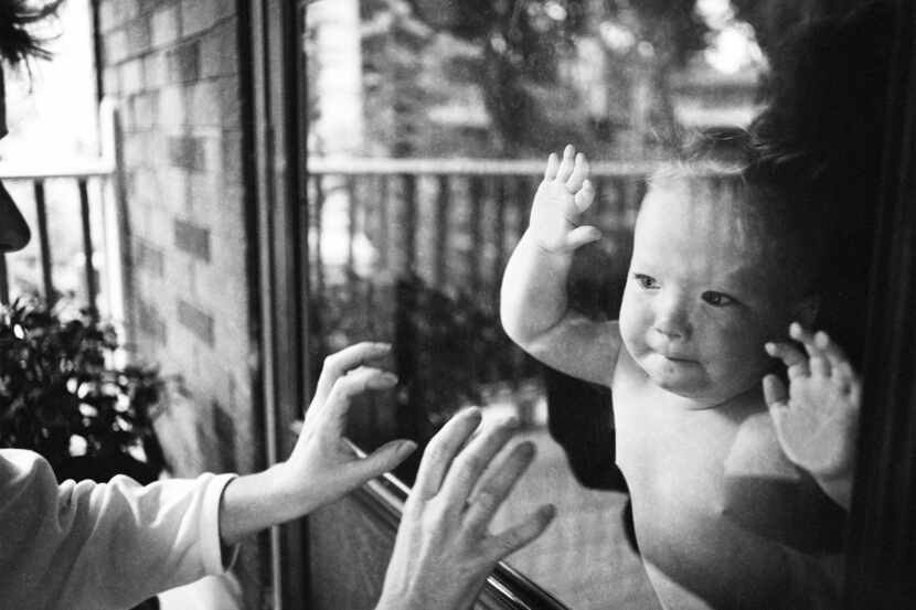 Photographer Debora Hunter rediscovered her 1989 photo "Baby Behind Glass" last year around...