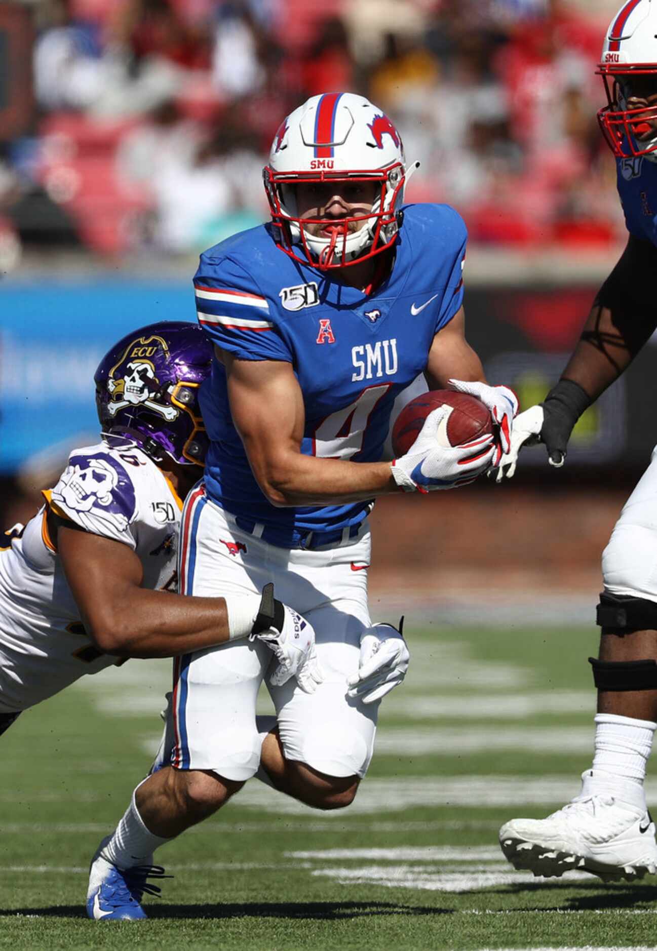 DALLAS, TEXAS - NOVEMBER 09:  Tyler Page #4 of the Southern Methodist Mustangs runs the ball...