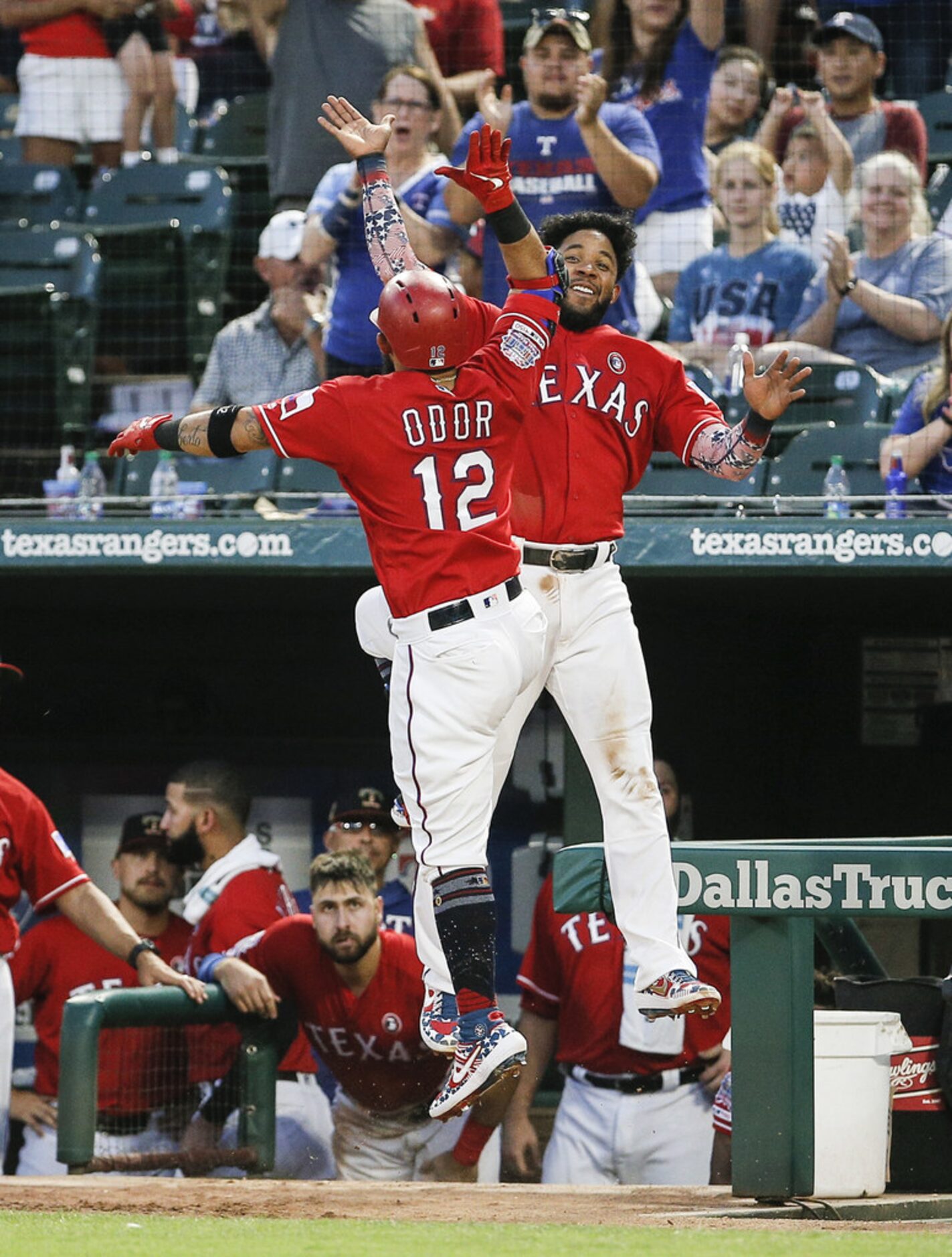 ARLINGTON, TX - JULY 4: Rougned Odor #12 of the Texas Rangers is congratulated by Elvis...