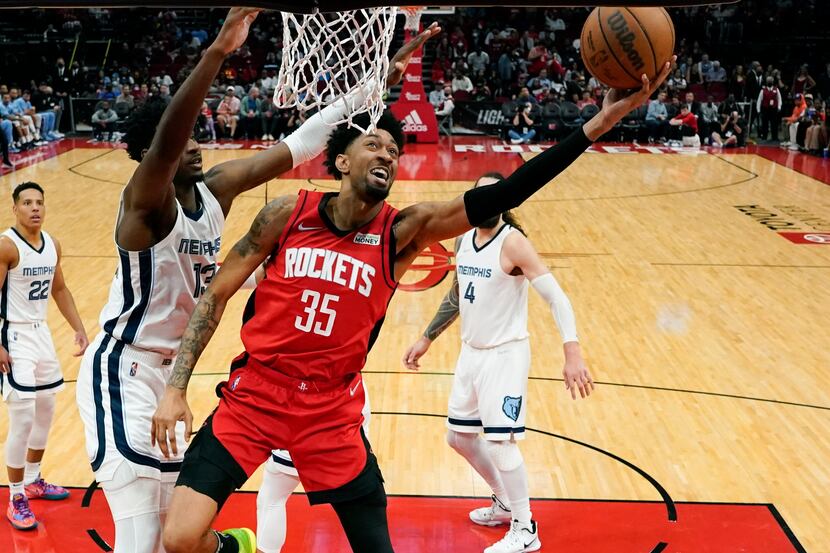 FILE - Houston Rockets center Christian Wood (35) shoots as Memphis Grizzlies forward Jaren...