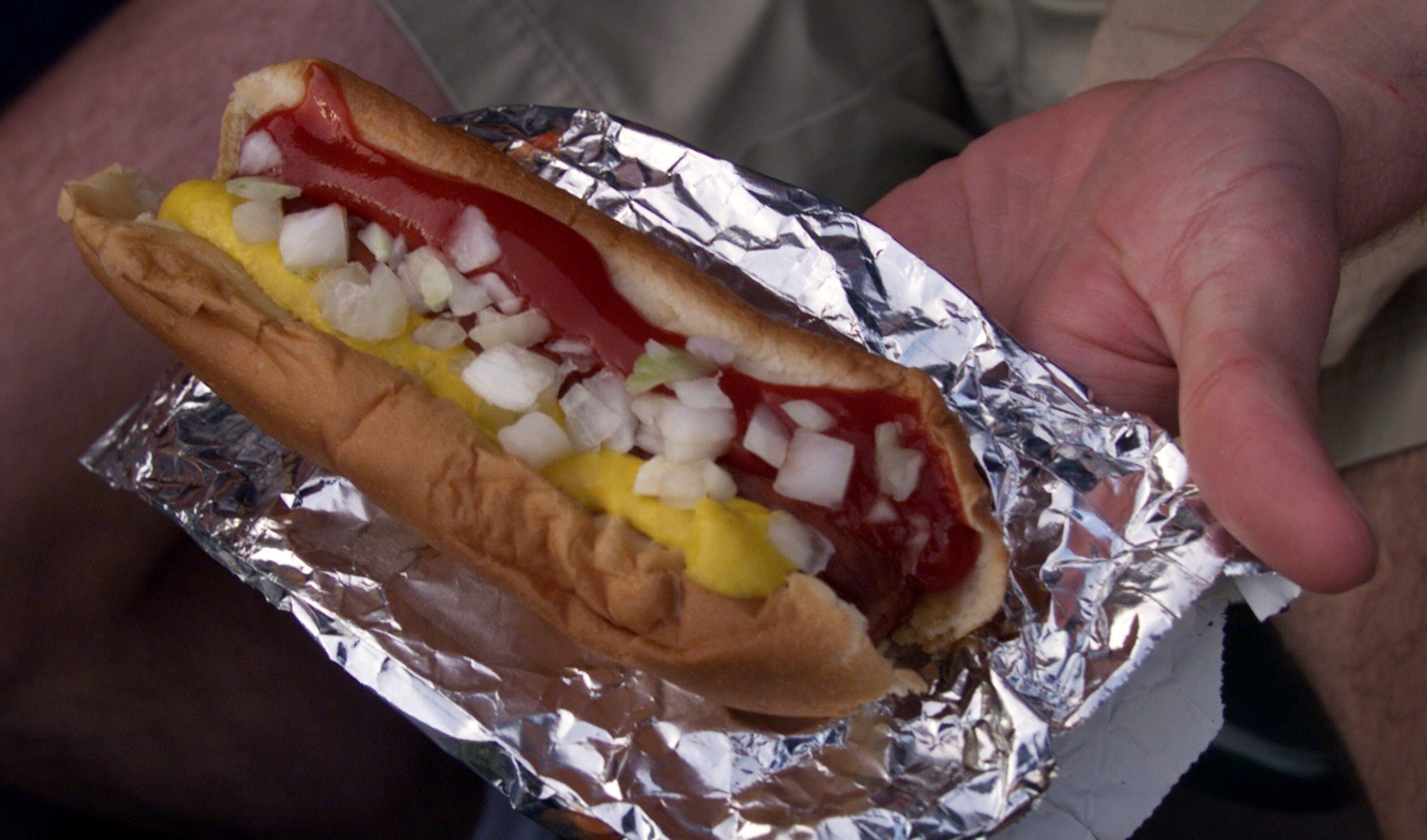 A baseball classic - a hot dog loaded with ketchup, mustard and onions ... as popular today...