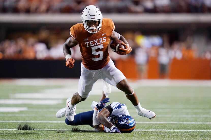 FILE - Texas running back Bijan Robinson (5) runs for a first down against UTSA during the...