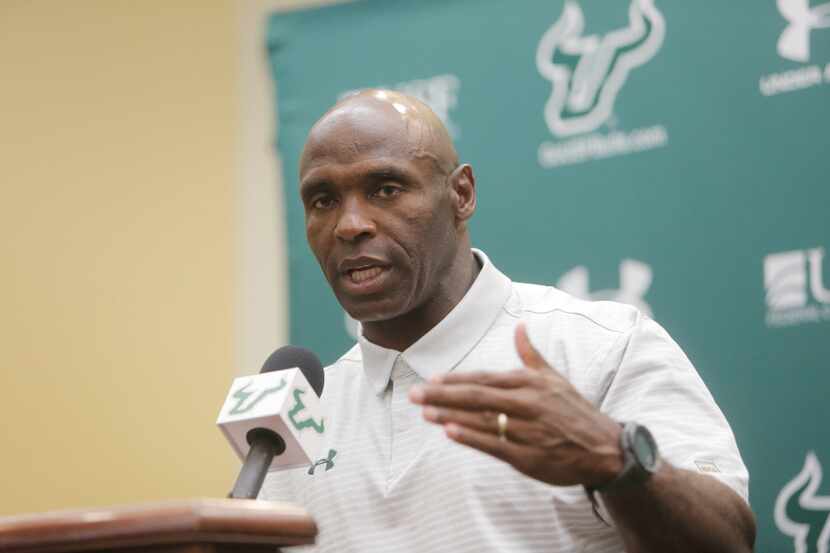 South Florida head football coach Charlie Strong talks to the media during a press...