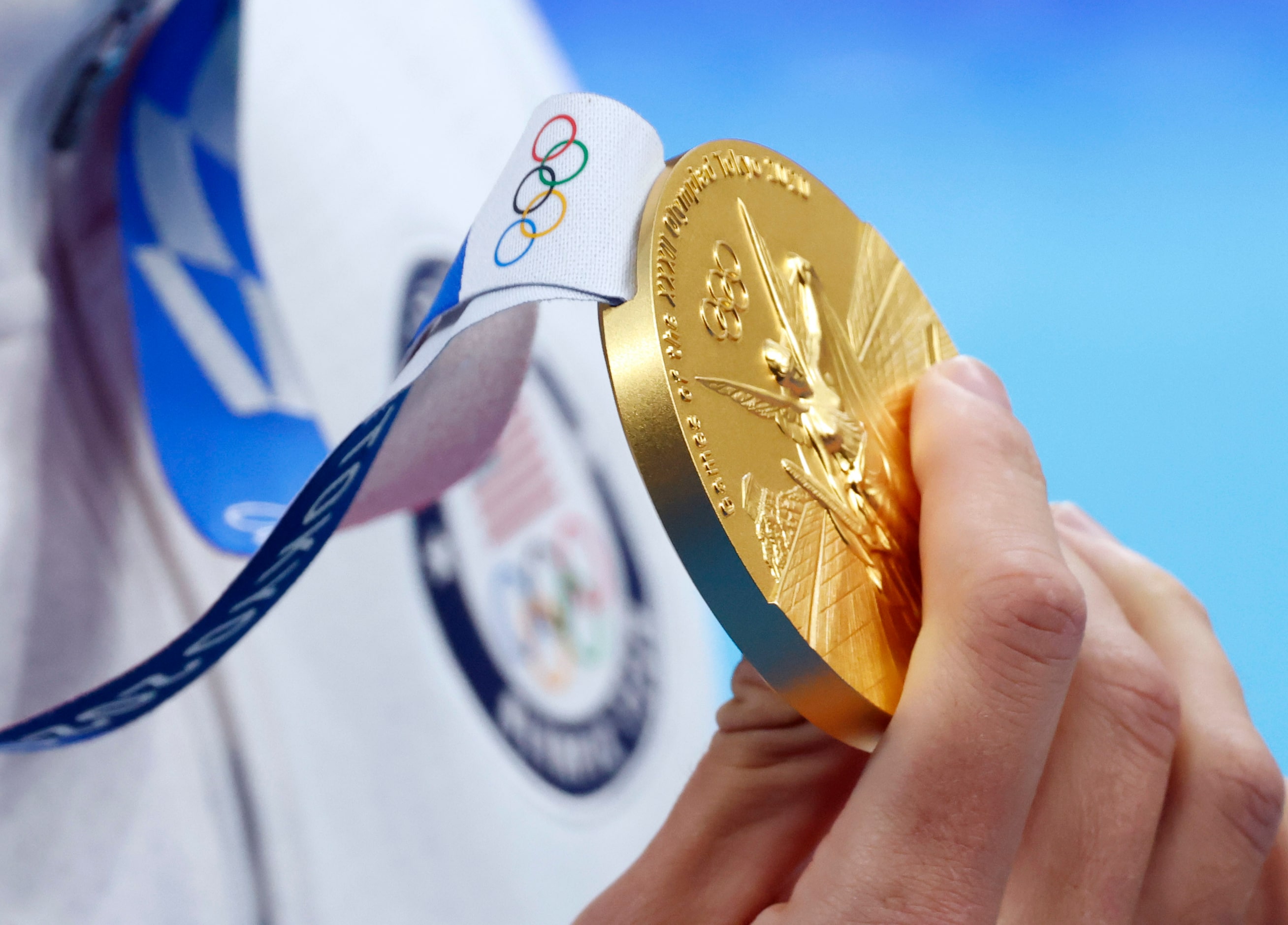 USA’s Caeleb Dressel poses for photographers after  receiving his gold medal during the...