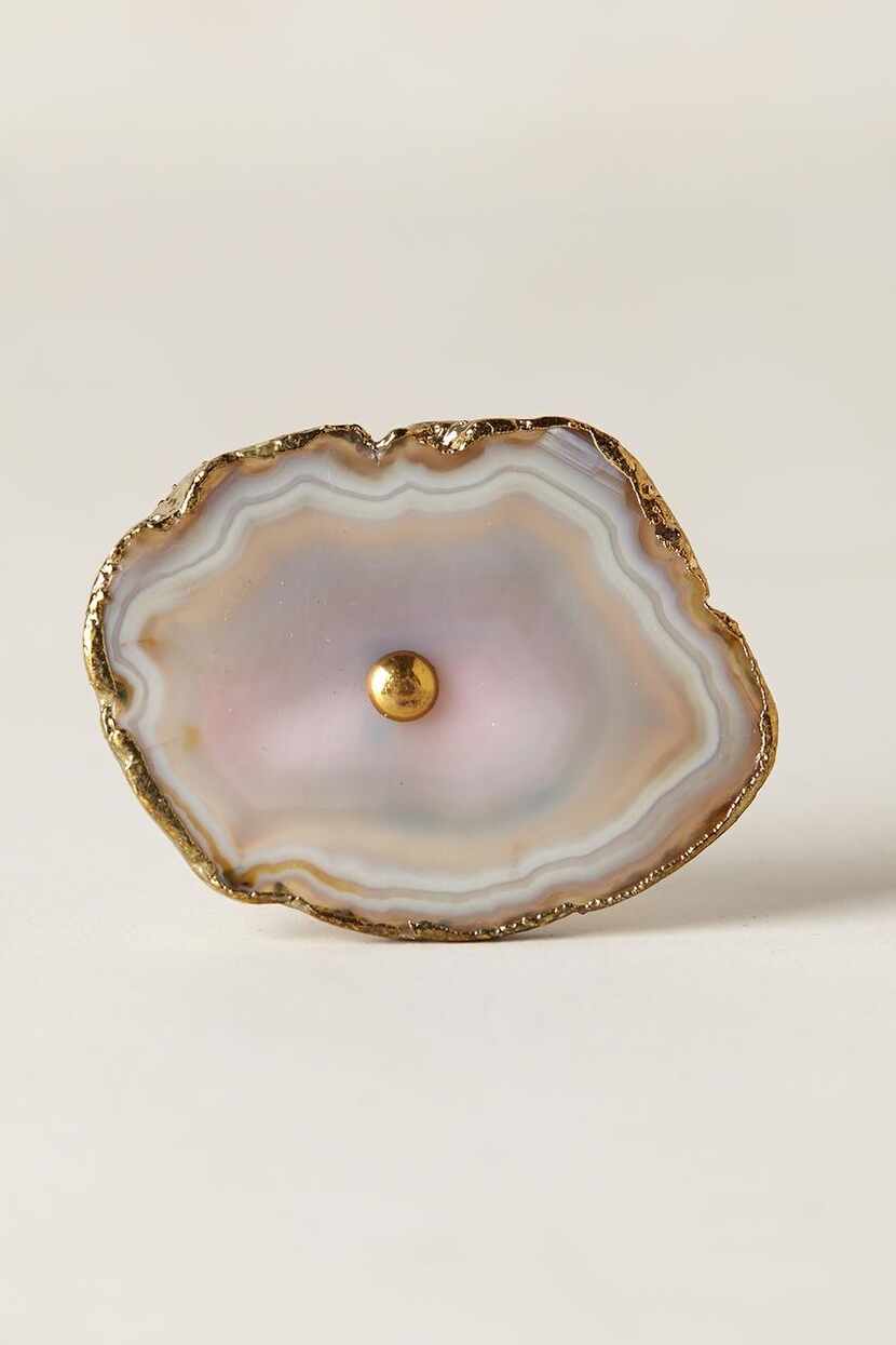 
Geode knobs edged in brass are just the thing for dressing up the drawer of an armoire,...