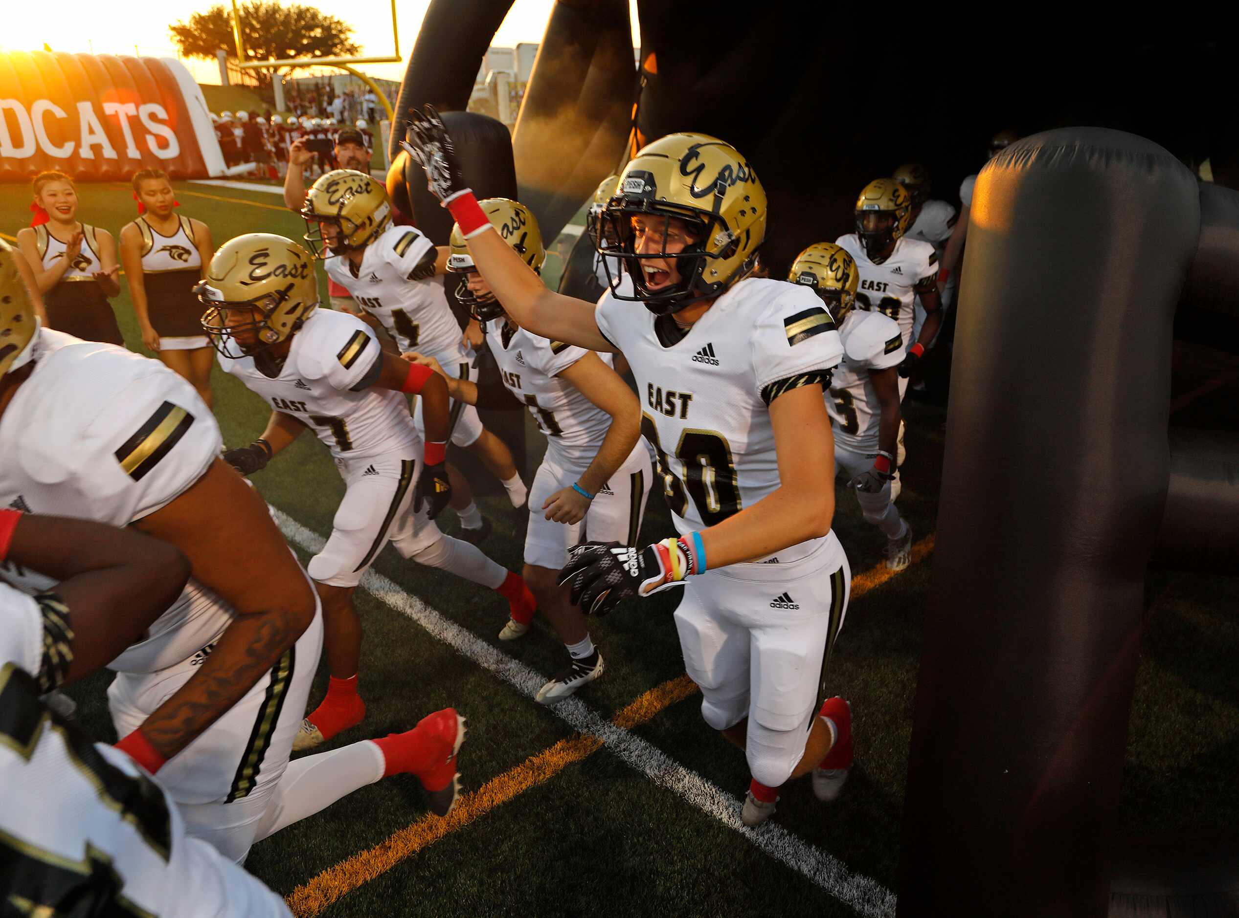 Plano East takes the field before kickoff as Plano High School hosted Plano East High School...