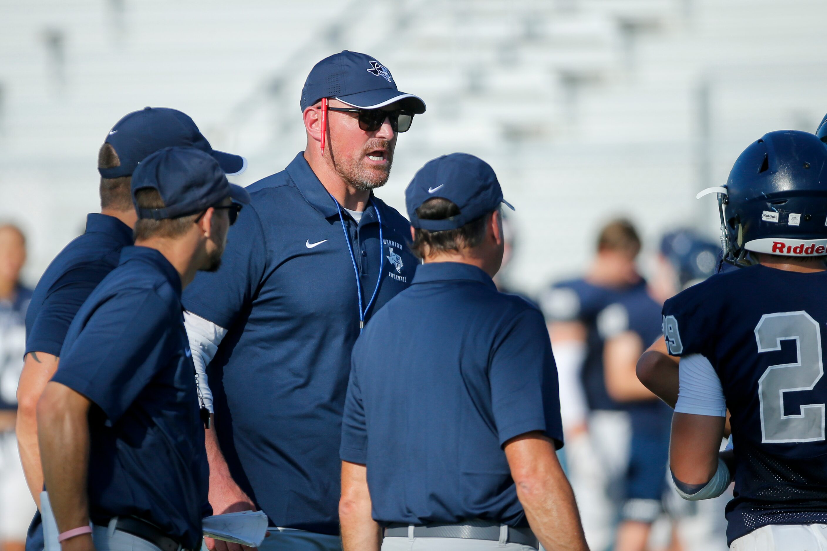 Argyle Liberty Christian head coach Jason Witten speaks with coaches and players during a...