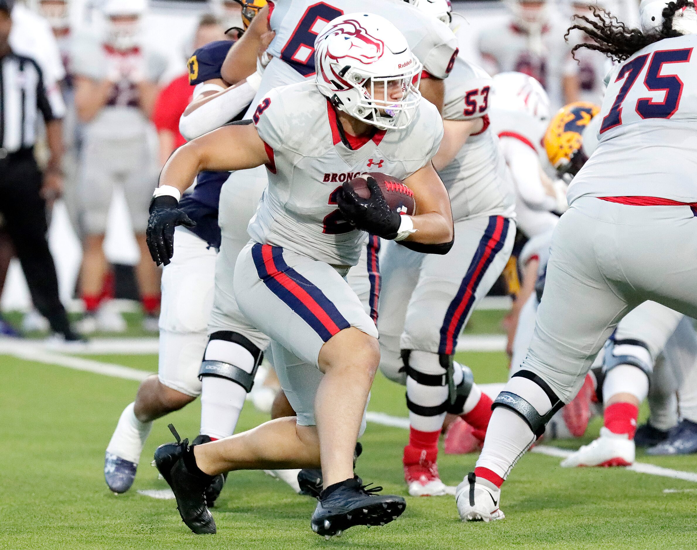 McKinney Boyd High School running back Tyler Wall (2) carries the ball during the first half...