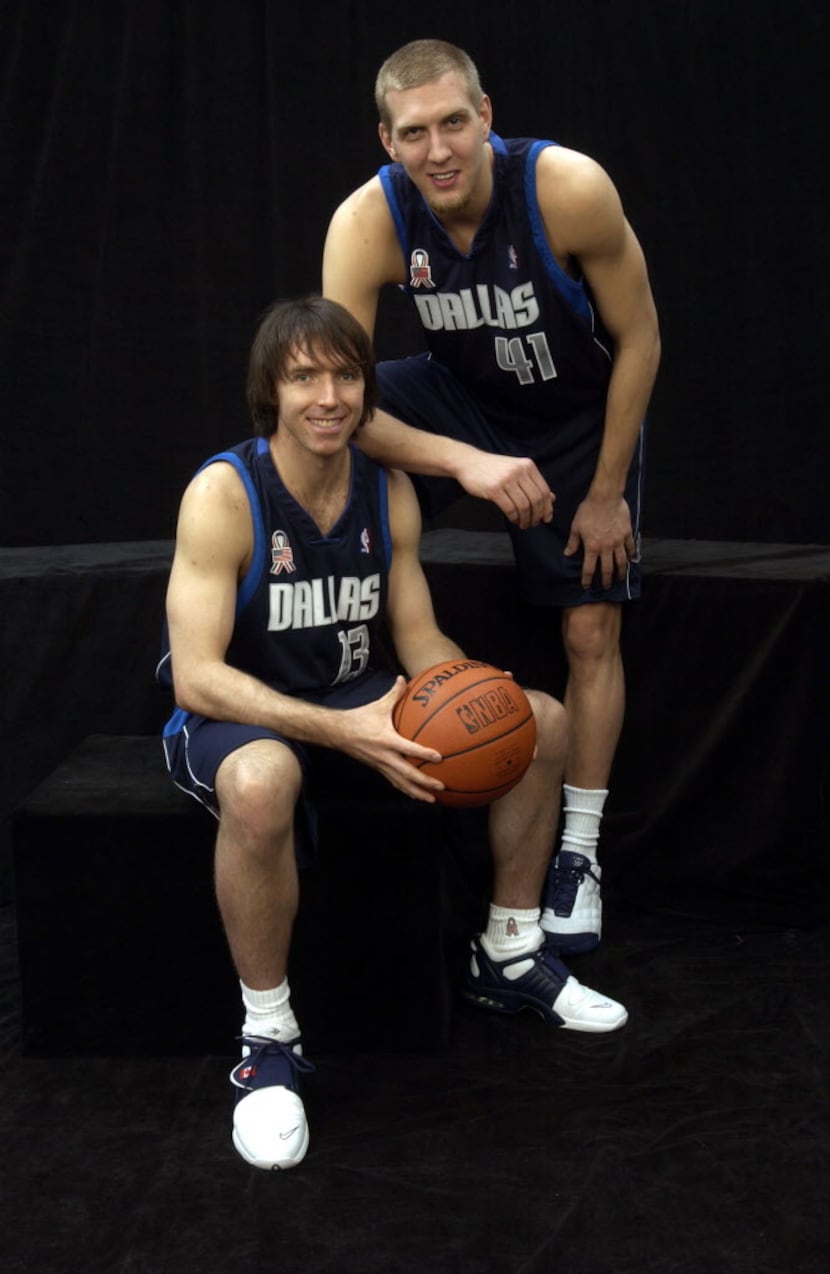 Steve Nash #13 of the Dallas Mavericks poses with teammate Dirk Nowitzki #41 of the prior to...