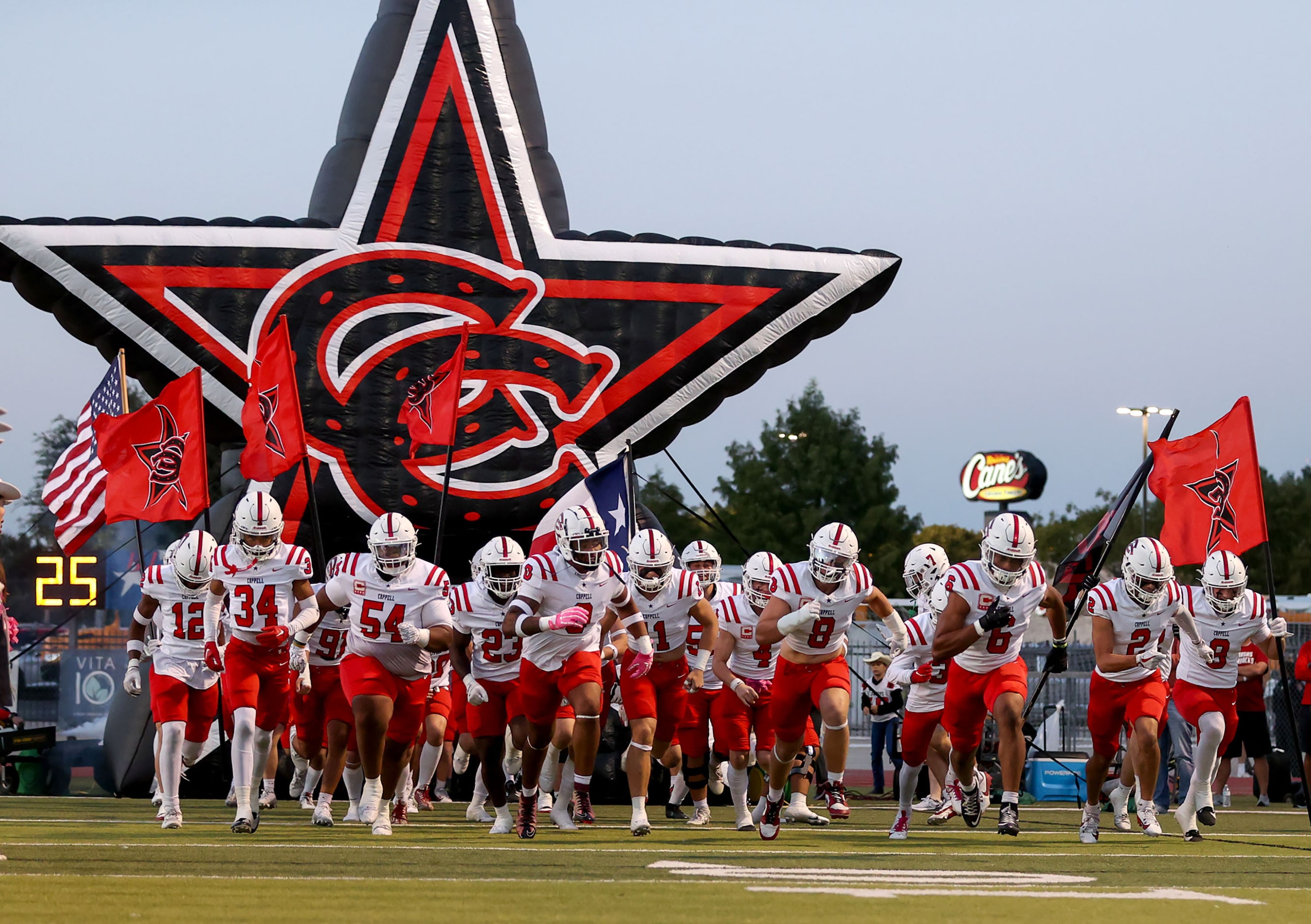 The Coppell Cowboys enter the field to face Lewisville in a District 5-6A high school...