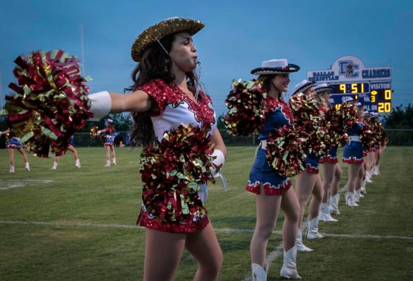 John Paul II’s Cardinal Belles warm up before the football game against between the John...