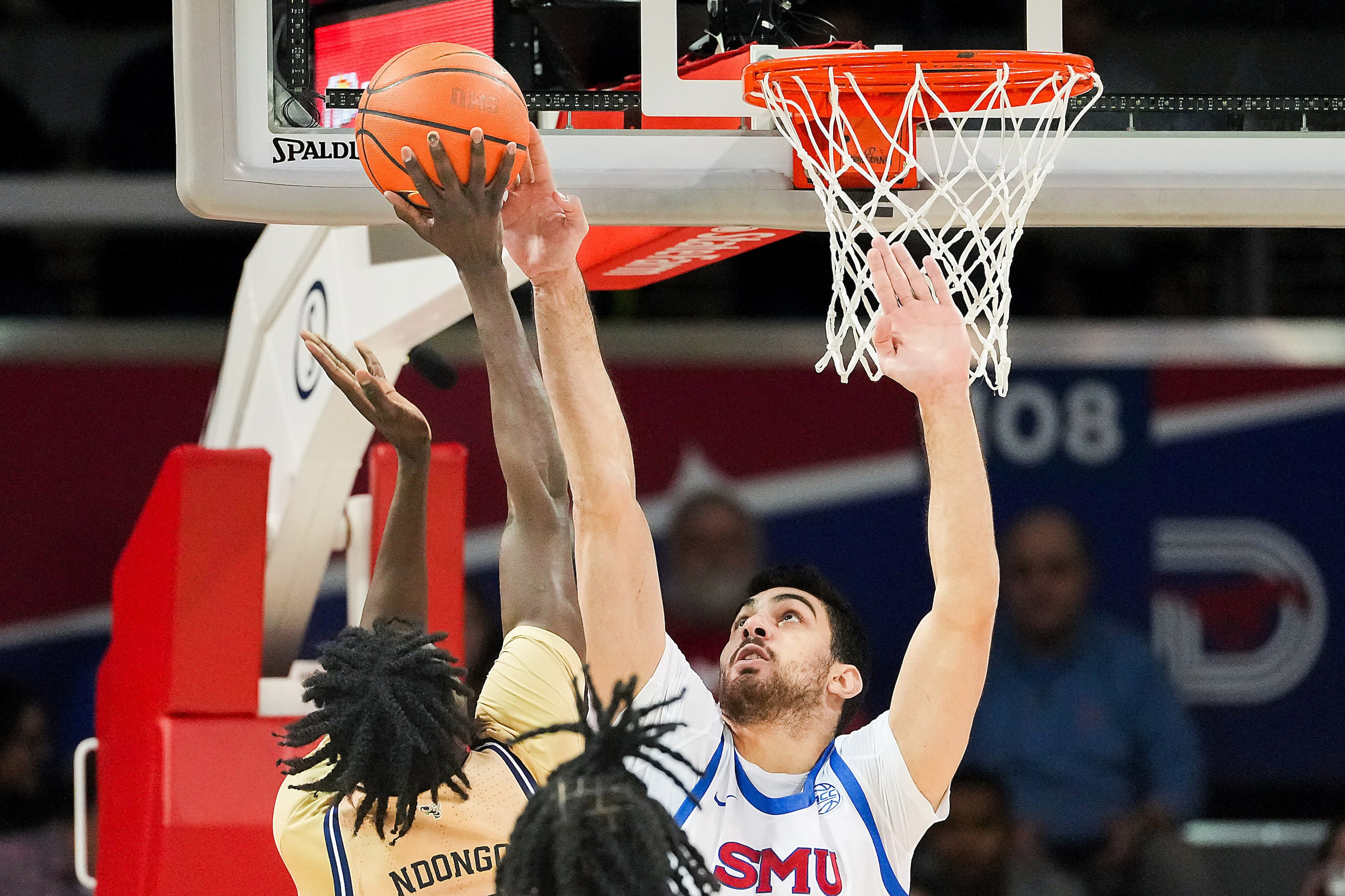 SMU center Samet Yigitoglu blocks a shot by Georgia Tech forward Baye Ndongo during the...