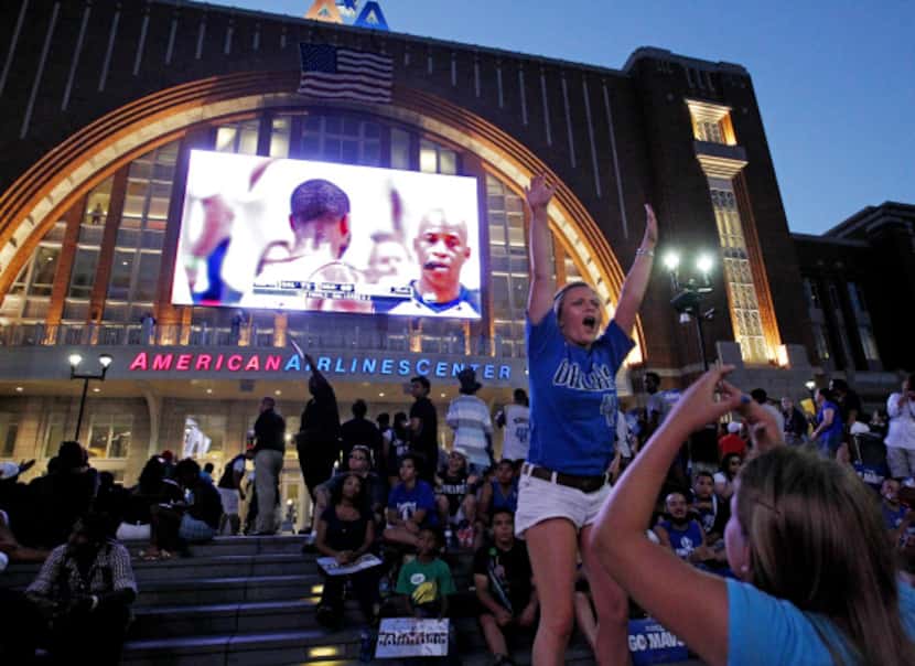 Tasha Savage and Savannah Gandee cheer for the Mavs as they watch the game outside on AT&T...