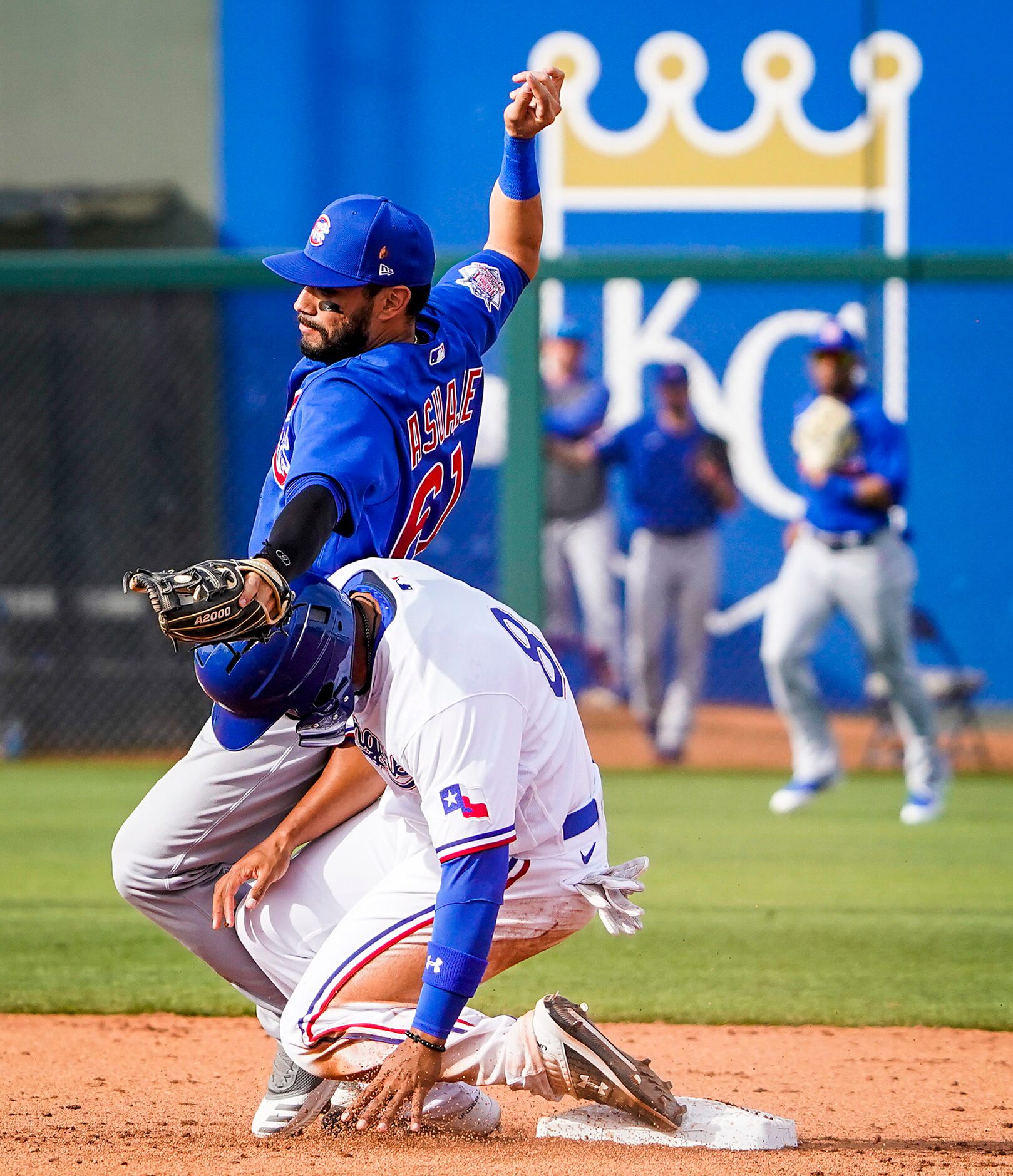 Texas Rangers designated hitter Josh Morgan gets tangles with Chicago Cubs second baseman...