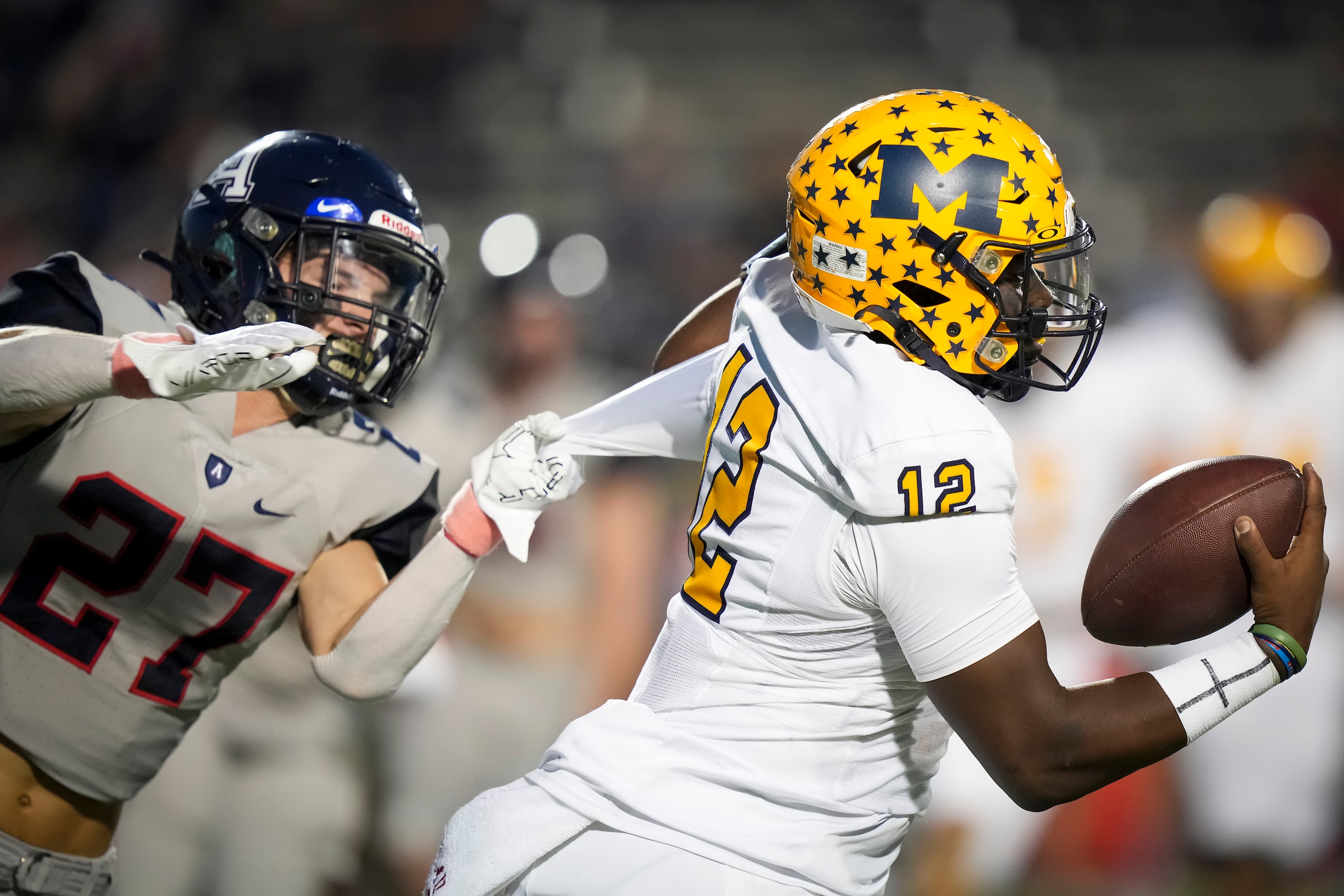 McKinney quarterback Keldric Luster (12) scrambles away from Allen cornerback Emery Lasseter...