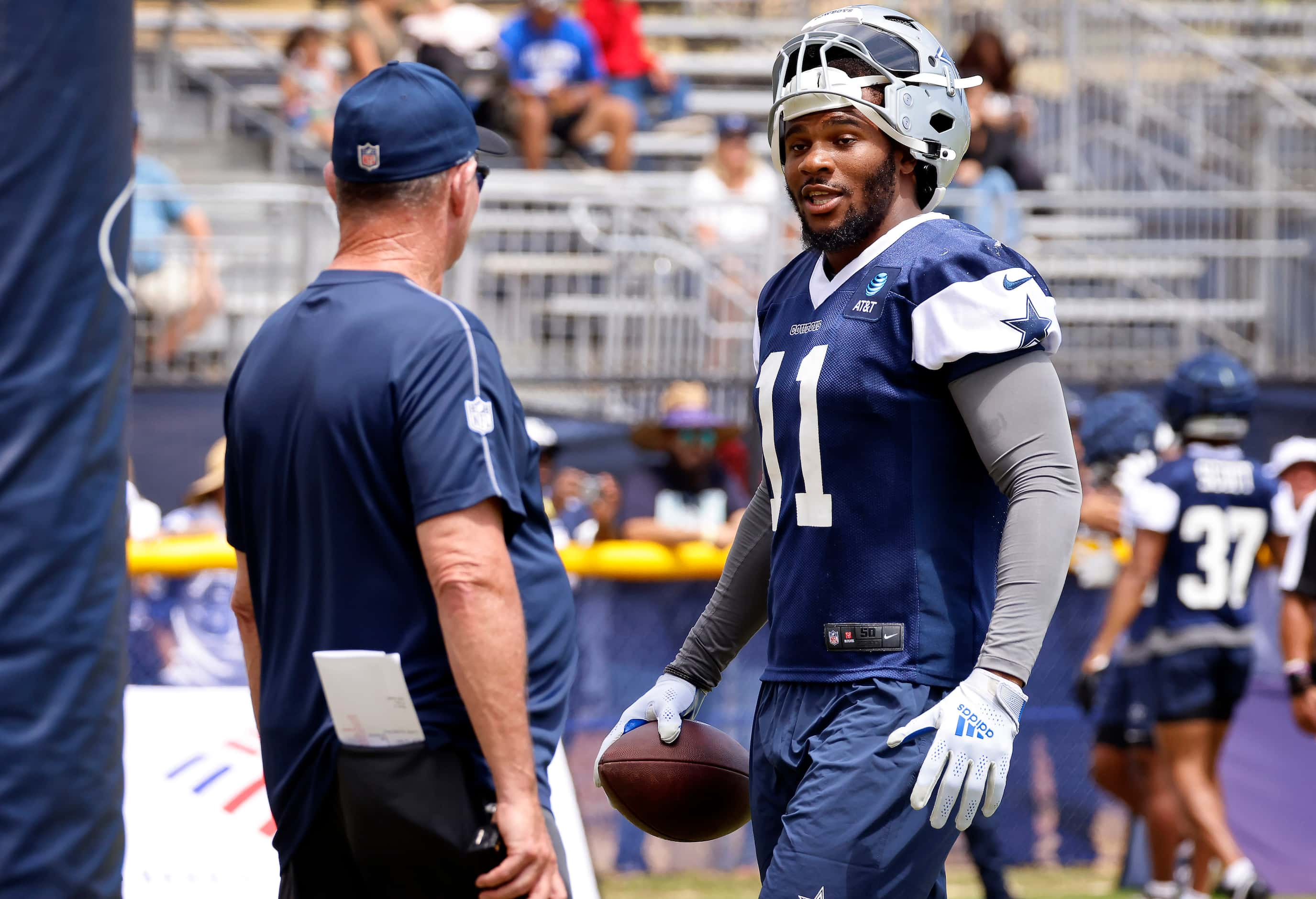 Dallas Cowboys linebacker Micah Parsons (11) smiles as he approaches Dallas Cowboys...