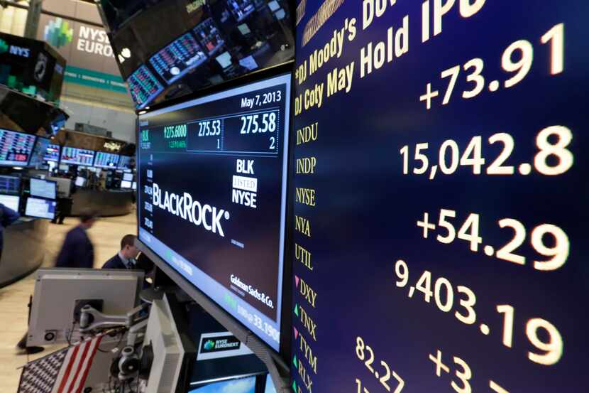 A board on a trading post on the floor of the New York Stock Exchange shows the Dow Jones...