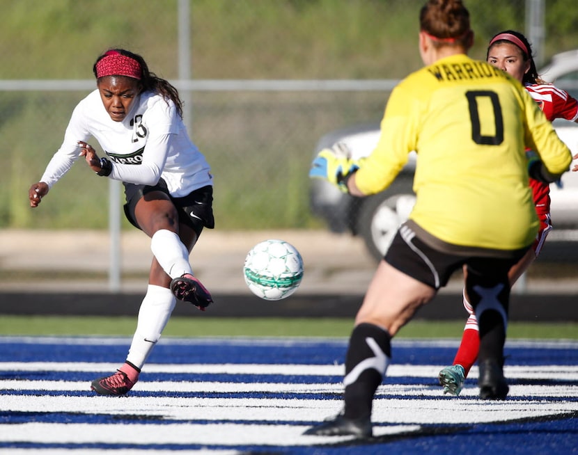 Southlake Carroll forward Ally Griffin (23) scores a goal against South Grand Prairie keeper...