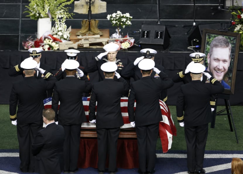 An honor guard saluted Chris Kyle during the memorial service for the former Navy SEAL at...