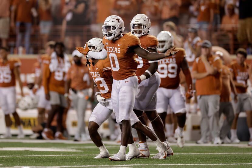 DeMarvion Overshown #0 of the Texas Longhorns reacts after a targeting penalty in the second...