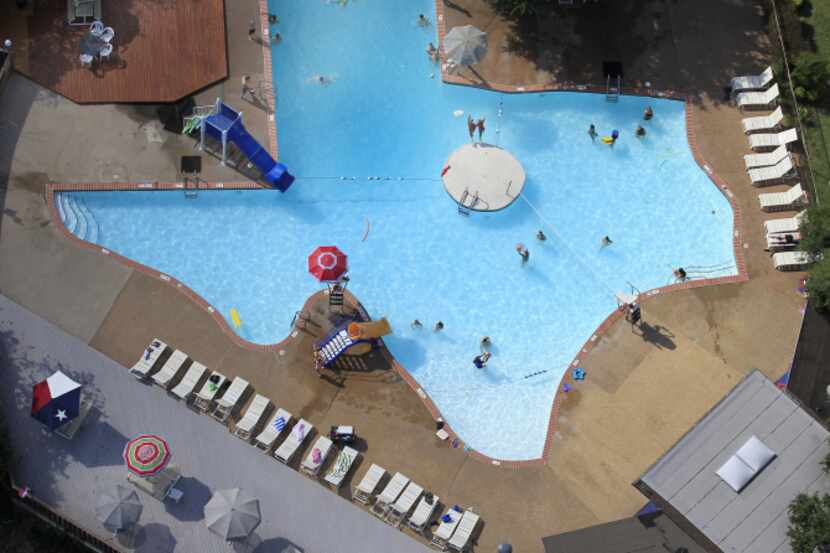 Swimmers enjoy The Texas Pool, a pool shaped like the state of Texas, located at 901...