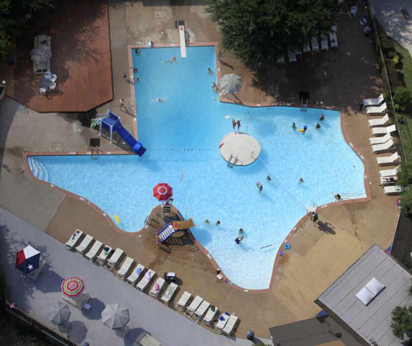 Swimmers enjoy The Texas Pool, a pool shaped like the state of Texas, located at 901...