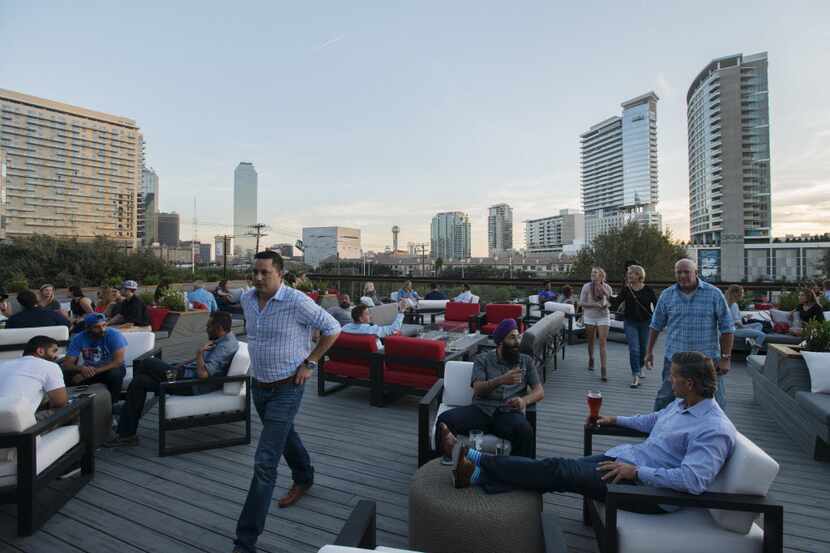 Soak up 360-degree views of downtown Dallas and Victory Park from Happiest Hour's rooftop...