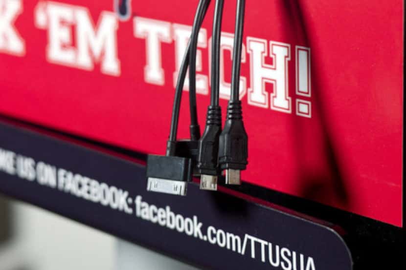 The college-themed charging stations can hold eight mobile devices using one outlet. Schools...