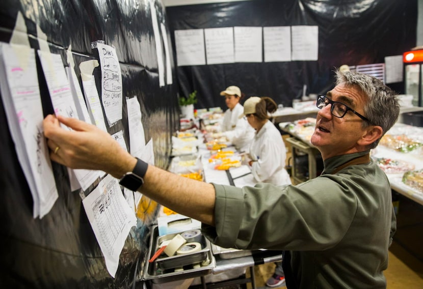 Executive Chef Christof Syre checks orders in the "sandwich room" during round 2 of the AT&T...