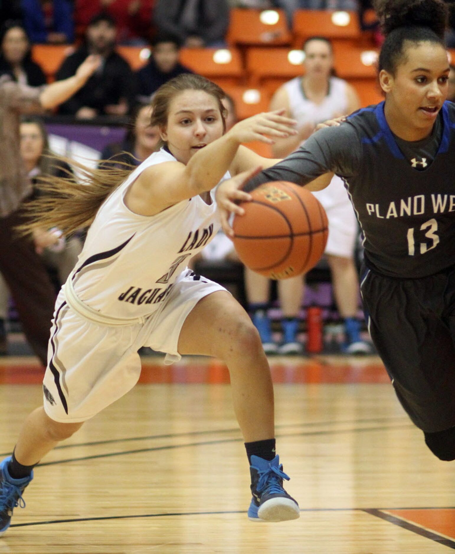 Flower Mound High School junior Kenzie Grill (3) tries to steal the ball from Plano West...