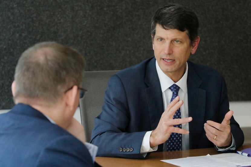 Dr. Fred Cerise (right), CEO of Parkland, talks with Brendan Miniter, vice president and...