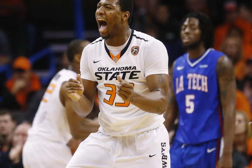 Oklahoma State guard Marcus Smart (33) celebrates in the first half of an NCAA college...