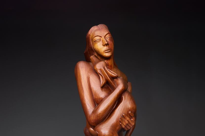 Octavio Medellín's "Genoveva of Brabante" (detail shown), a 1949 carving in red mahogany, is...