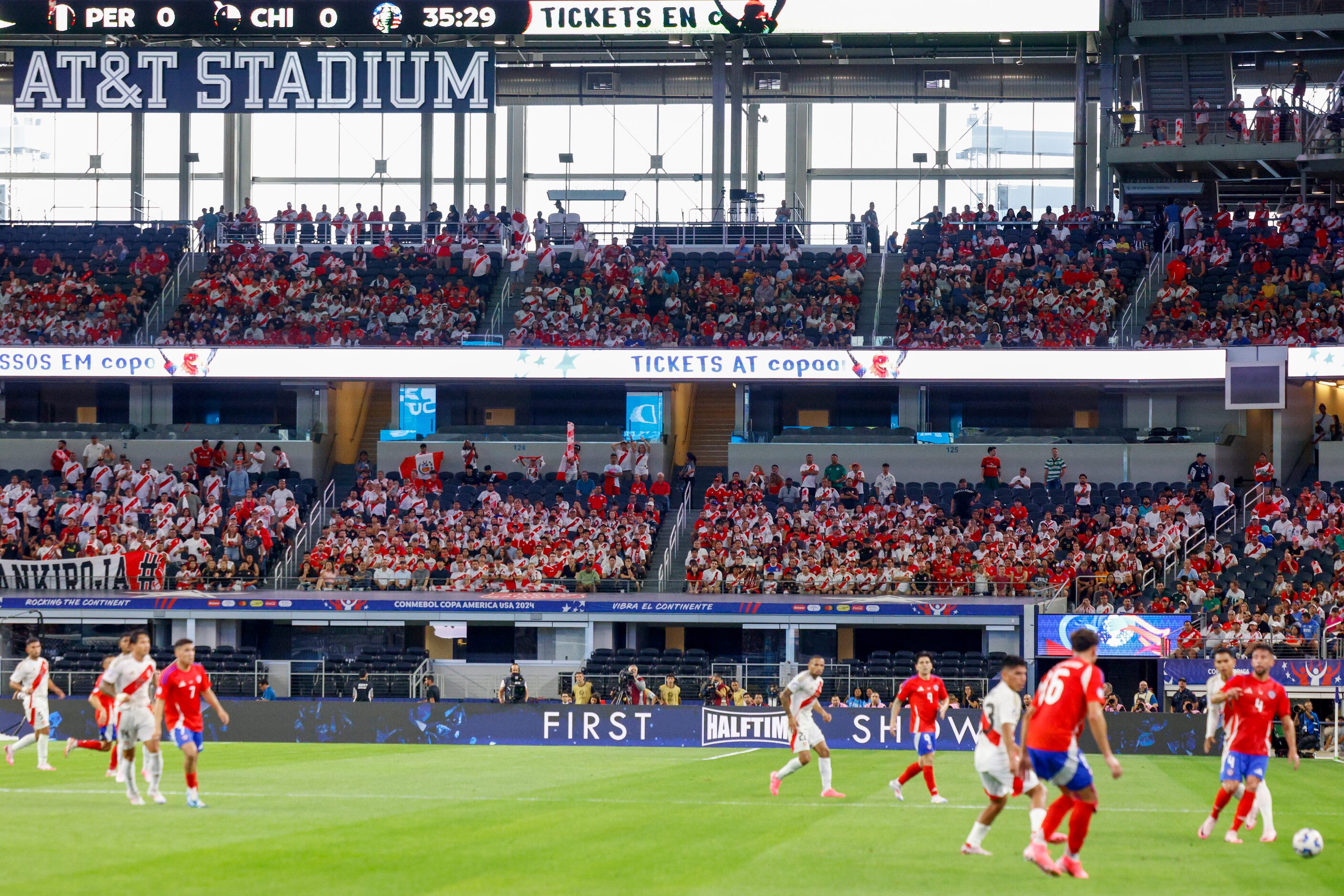 Chile and Peru soccer fans watch the first half of a Copa America Group A soccer match at...